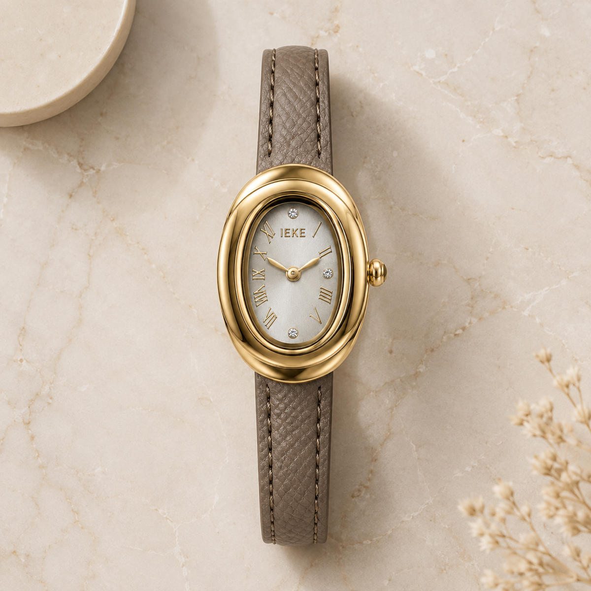 Montre Éclat Ovale Dorée – Bracelet Taupe & Cadran Champagne