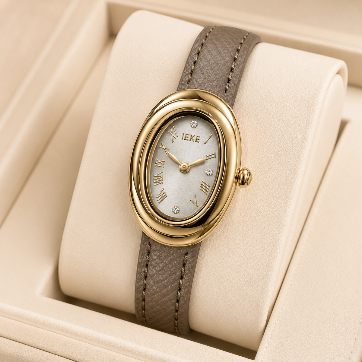 Montre Éclat Ovale Dorée – Bracelet Taupe & Cadran Champagne