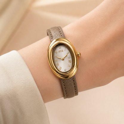 Montre Éclat Ovale Dorée – Bracelet Taupe & Cadran Champagne